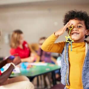 This image depicts a delightful scene in a vibrant classroom setting.