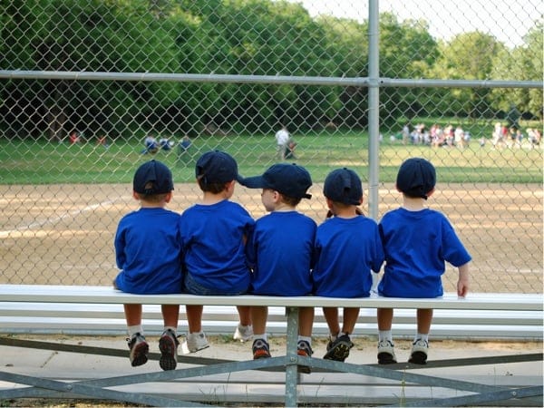 This image captures a heartwarming scene of five young children