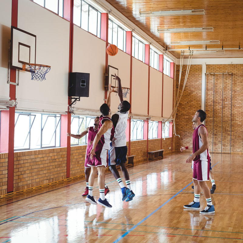 adults-playing-basketball-indoors-web