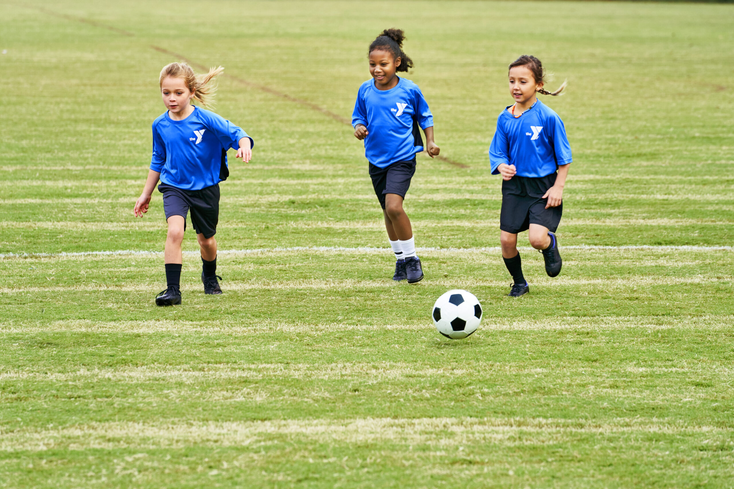 Young girls playing soccer